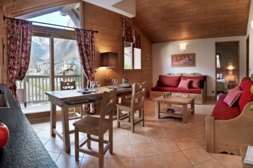 An artist's impression of an example of the lounge area of a Two Bedroom Apartment in L'Oree Des Neiges, Vallandry, France