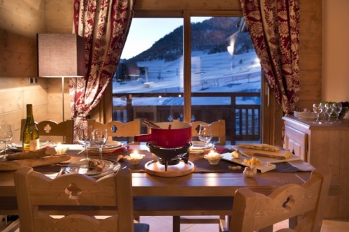 An artist's impression of an example of a dining room in a Three Bedroom Apartment in L'Oree des Neiges, Vallandry, France