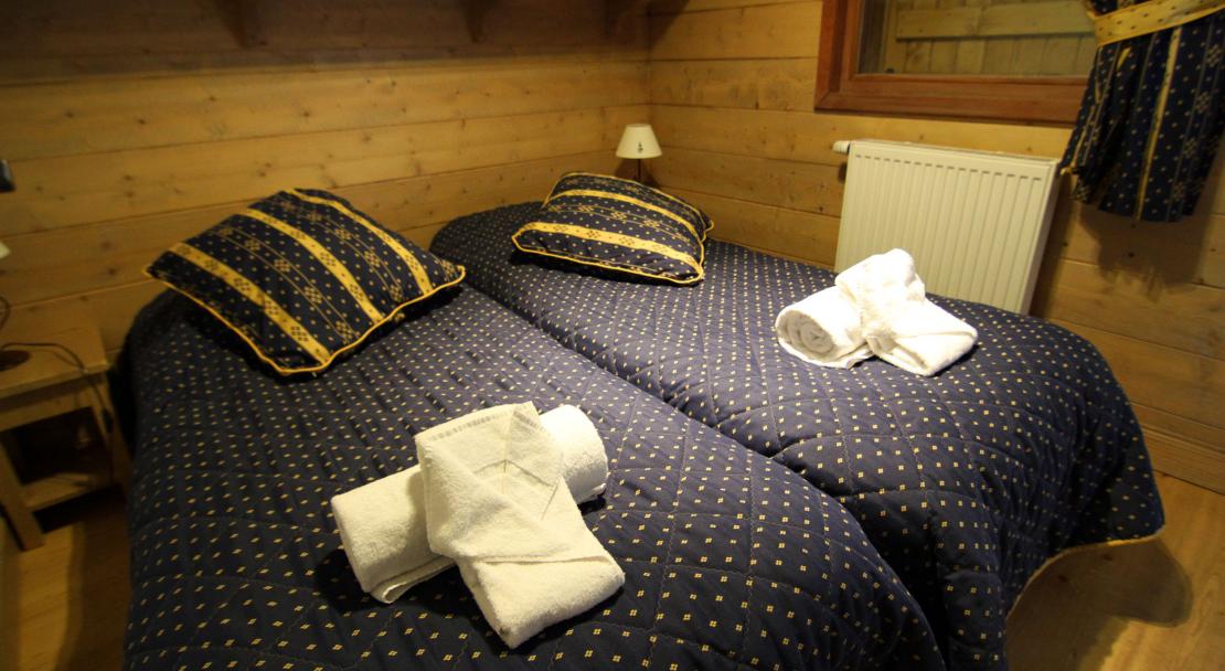 A twin bedroom at the Ferme du Val Claret 
