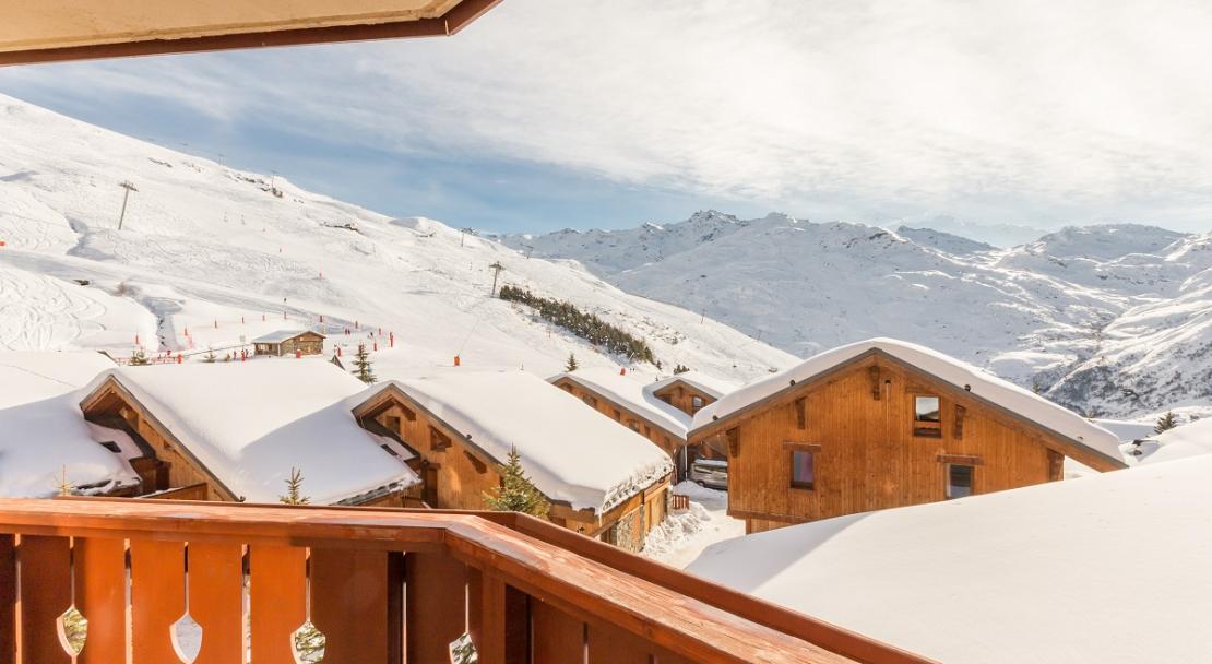 Sunny snowy mountain views from balcony at Les Alpages de Reberty Les Menuires; Copyright: Imagera