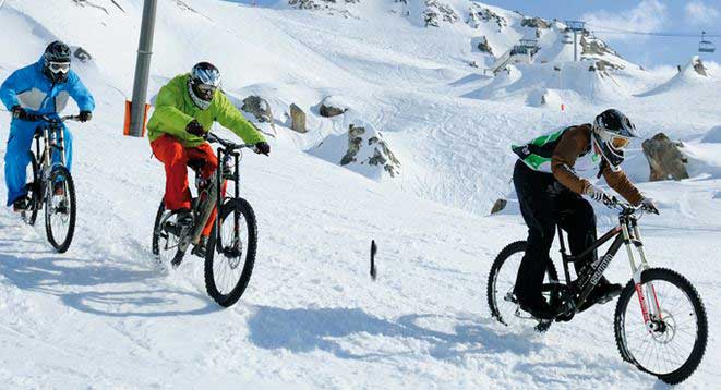 Mountain biking in snow Tignes
