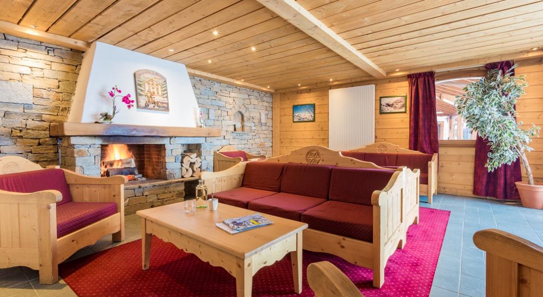 Reception lounge fireplace sofas Chalet de l'Adonis Les Menuires LVH