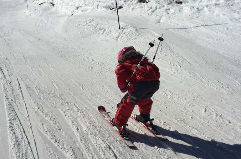 Kid skiing fast
